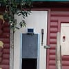 Automatic door terceira on a human size door of a plastic henhouse