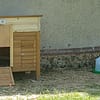 Nice little wooden chicken coop with an automatic guillotine door and a remote solar cell.